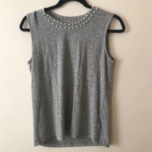 Sleeveless women's top with pearl detail neckline